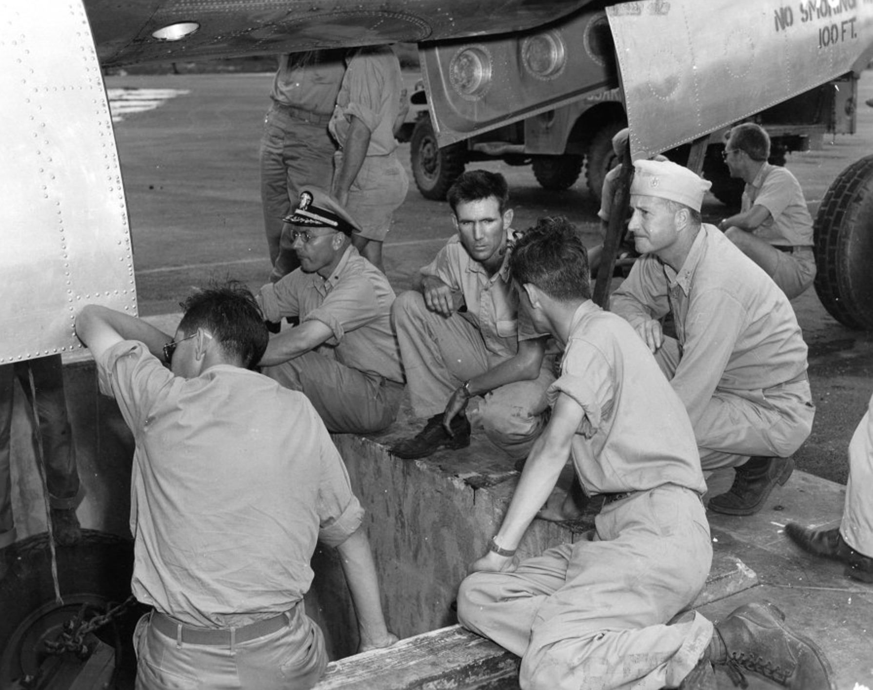 Supervising the loading of the Little Boy bomb into the B-29 Enola Gay. Norman Ramsey is on his left, with his back to the camera.